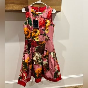 Oscar de la Renta taffeta floral print midi length dress with front pockets.
